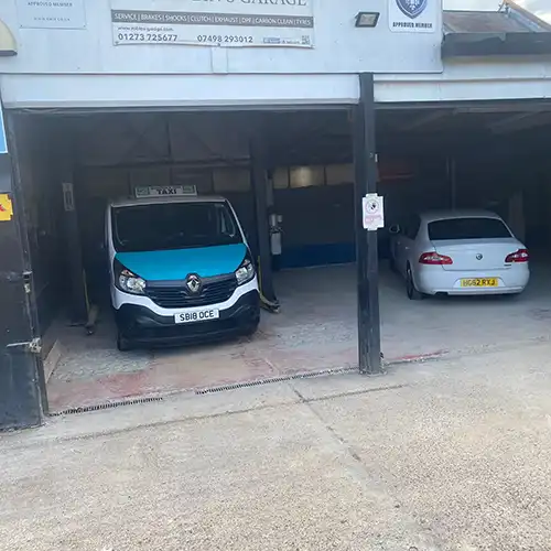 two cars are parked in a parking garage