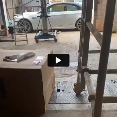 a white car is parked in a garage